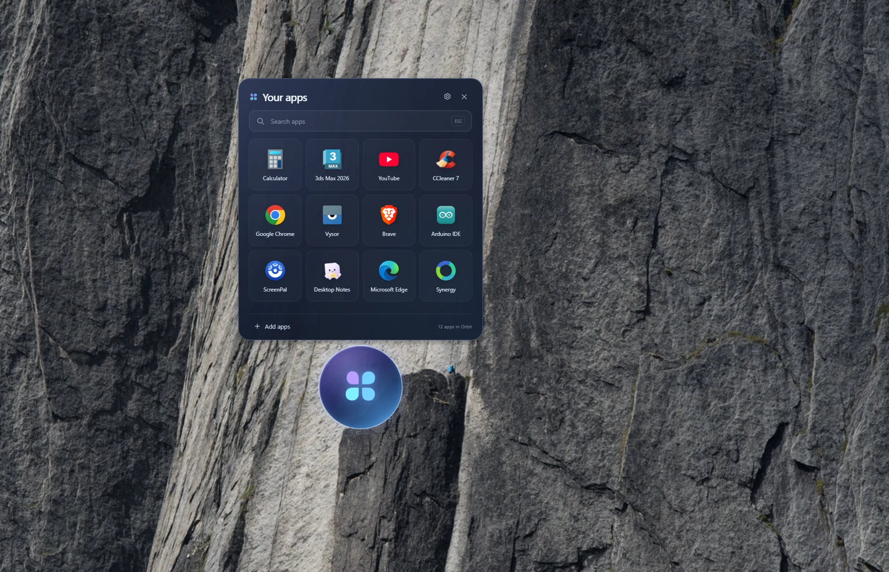 Orbit Windows app launcher showing a search field and a grid of shortcuts, including Calculator, Chrome, Brave, and Arduino IDE, above its floating desktop icon.